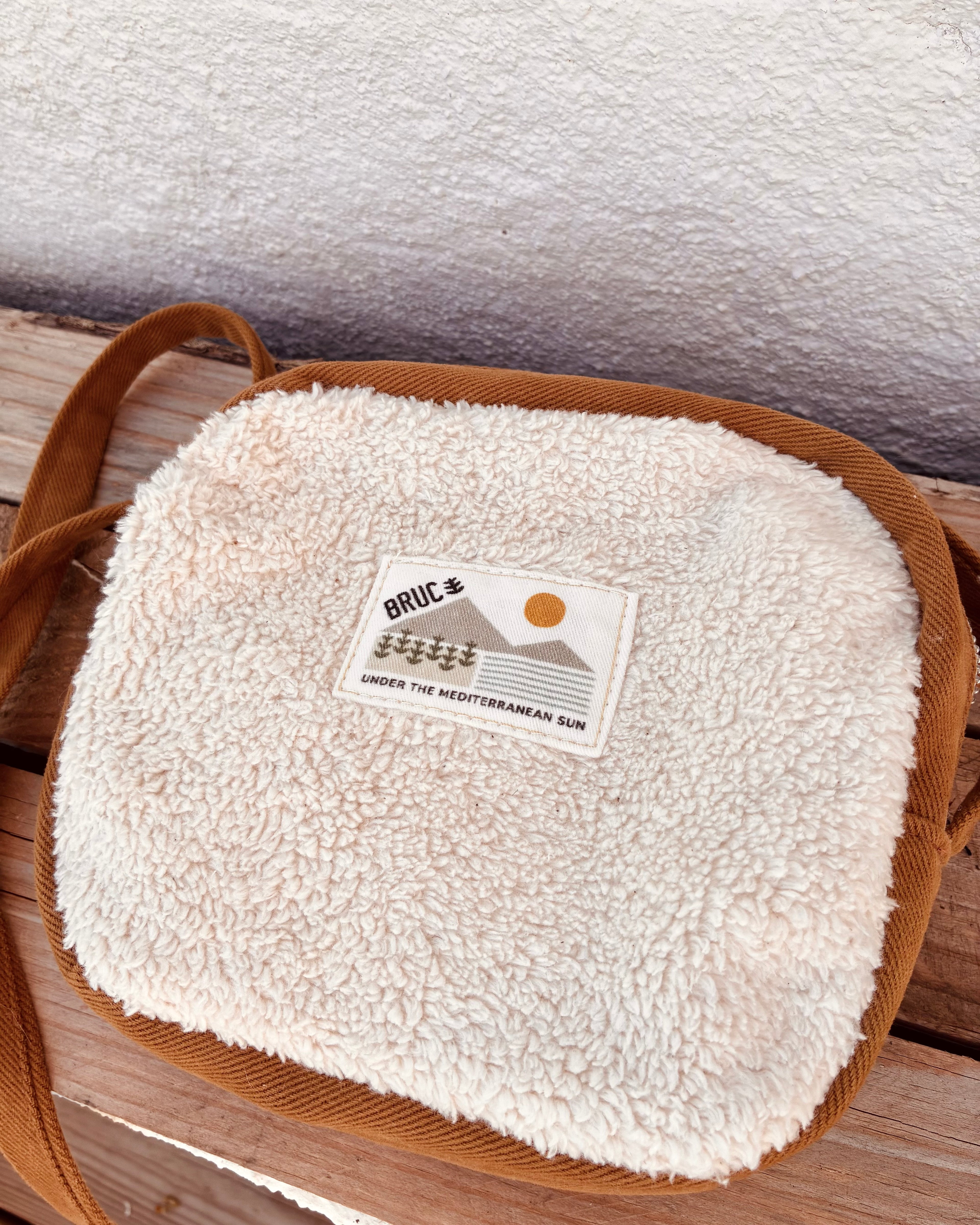 COMPACT CROSSBODY BAG · Sherpa's warmth