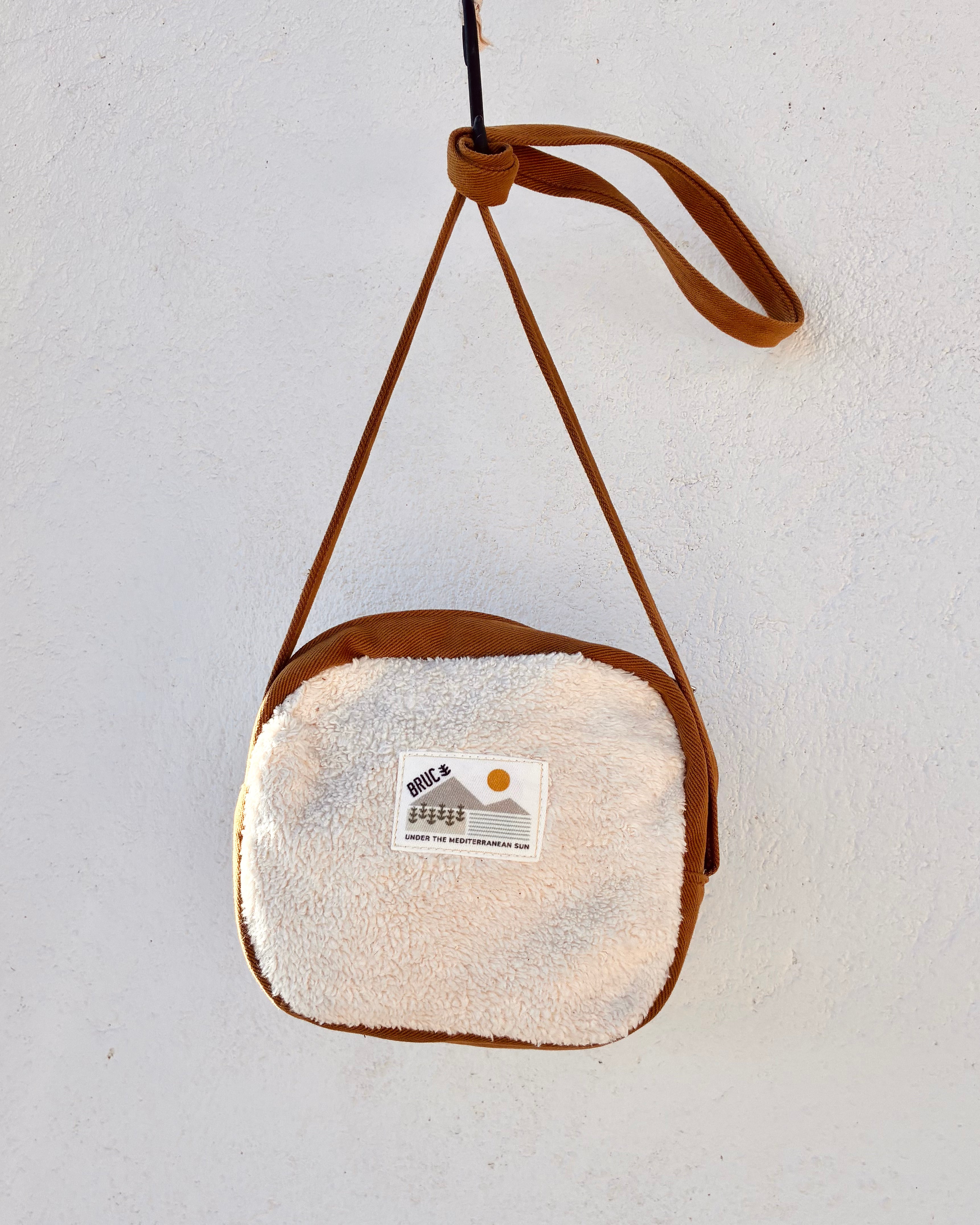 COMPACT CROSSBODY BAG · Sherpa's warmth
