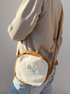 COMPACT CROSSBODY BAG · Sherpa's warmth